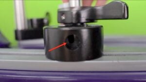 Base clamp adjustment access hole